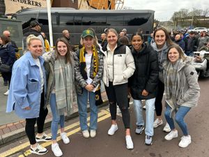 Isla with members of the Wolves women's team outside Molineux