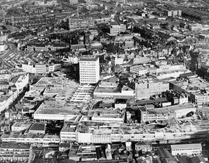 March 2, 1968, another aerial view across Wolverhampton, the caption reads: 'Although the Mander Centre, Wolverhampton, was formally opened by the Mayor, Alderman E Y Fullwood today, and while the tower office block to the centre is partly occupied, the centre is still very much a shell plus much-needed parking for about 550 cars. Really what was opened today is a series of pedestrian walkways through the centre. Two or three shops are ready for business. Many more are to come, but for some time the centre will be a place of vacant boxes that one day will be shops. Among those to come include a 54,000 square feet department store for Owen Owen, a Tesco supermarket, and a Timothy White and Taylors shop, to name but a few.'