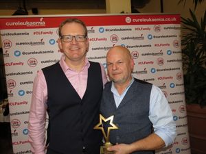Steve Plant is presented with the trophy by James McLaughlin