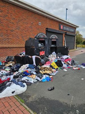 Pictures taken on Sunday show a large pile of clothing outside the donation bins at the centre. Photo: Stuart Shinton