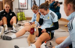 Player Lucy Staniforth meets puppy Stan, named after her