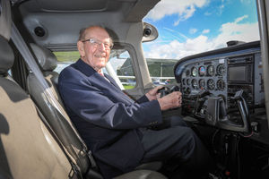 Johnnie in the pilot seat of the Cessna four-seater