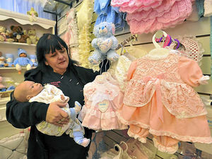 Supporting image for story: Lifelike babies that are just for cuddling