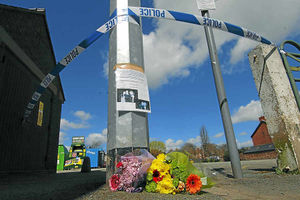Floral tributes at the scene of the stabbing in Oswestry