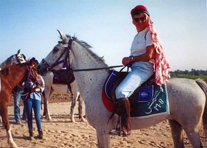 Trekking through the desert on a horse