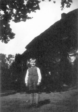 Tony VanDijk in front of the family homestead in 1950.