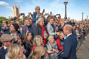 The Prince of Wales meets members of the public in the queue along the South Bank as they wait to view Queen Elizabeth II lying in state ahead
