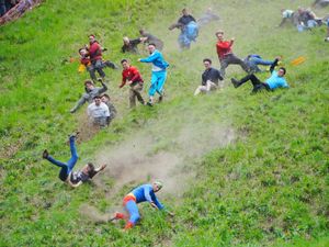 Supporting image for story: Gloucestershire cheese rolling race won again by German YouTuber Tom Kopke