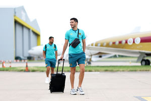 Striker Raul Jimenez is all smiles as he heads to the plane (Getty)