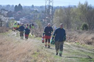 Fire crews carrying equipment to the scene of the fire