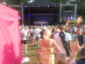 Crowds cheers the arrival of the baton on stage at The Quarry in Shrewsbury
