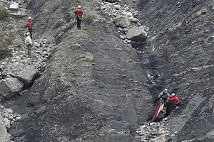 Rescue workers work on debris at the plane crash site near Seyne-les-Alpes, France