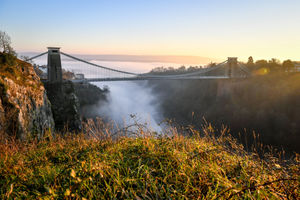 Mist runs underneath the Clifton Suspension Bridge in Bristol