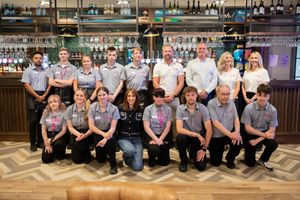 Team line-up: Alex Jones meets the staff at the Wonky Donkey.