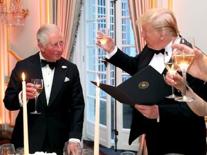 Donald Trump and King Charles raising a toast