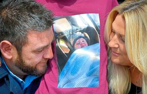 Ernie's parents Lee Bryan and Sam Allen with a picture of Ernie