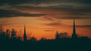Spires of Shrewsbury under the setting sun, photographed by Grant Ellson