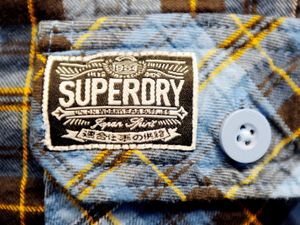 Supporting image for story: DJ, stilt walkers and break dancers at opening of new Telford Superdry store