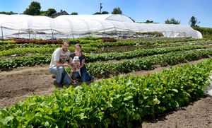Dave and Daphne Du Cros with baby Isla at their smallholding in Bishop's Castle