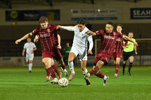 Dylan Allen-Hadley is challenged by two Chorley players. Picture: Kieren Griffin Photography