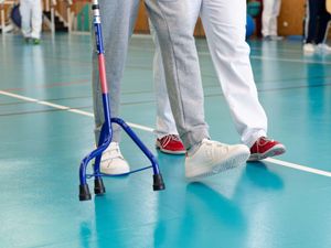 A person being helped in a rehabilitation centre