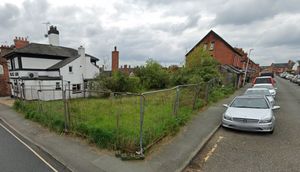 Attempts to build houses on the former home of Jones & Hughes Monumental Masons stone merchants on Salop Road in Oswestry have been ongoing since 2010. Photo: Google