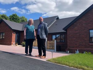 Sam Hine, who will be stepping down as chair of Shropshire Rural Housing Association, and chief executive, John Green. Picture: Shropshire Rural Housing Association 