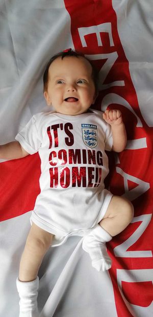 Laura Cole sent this photo of 16-week-old Mae Cole ready for the England game .
