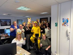 The team and a cardboard cut out Paddy McGuinness raised funds for charity  