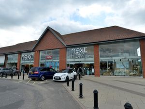 Supporting image for story: Next profits slide after tough year