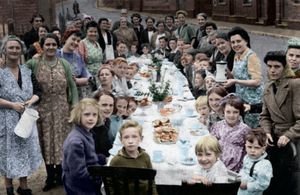 A street party to mark the end of fighting in Europe held in Hollyhedge Road, Walsall. Holding the jug was 20-year-old Florence Aldridge, while wearing the green cardigan opposite was her mother Elizabeth Mountford. Just behind her, in the green pinafore dress, is Elizabeth's other daughter, Gwendoline, and the white-haired figure just visible at the very back was Elizabeth's mother, only known as Mrs Peakman. The young girl, third from front on the right, is Florence's niece Beryl Mountford. The picture was supplied by Florence's son Philip Aldridge, who lives in Wednesfield, Wolverhampton.