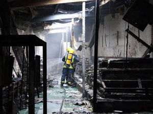 Supporting image for story: Clean up at gutted factory gets under way