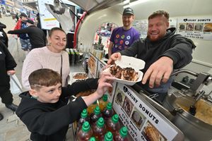 Getting some free donuts are Alfie Bunn and Samantha Wilkes