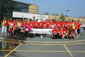 Participants celebrate reaching the end of the walk