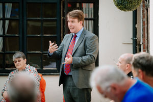 MP Craig Williams speaks at the meeting