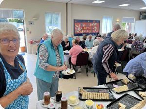 Rotarian Anne De Vere serving with a smile