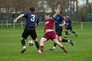 Dawley Town's Brodie McLeod  and FC Nations' George Robinson