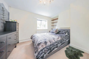 The master bedroom is well lit and spacious