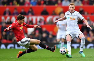 Manchester United's Victor Lindelof (left) challenges Swansea City's Sam Clucas. Picture: PA