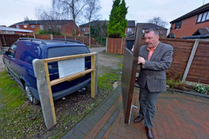 Nigel standing by the new bollard