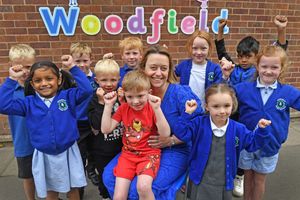 Headteacher Beck Preece and pupils at Woodfield Infant School & Nursery celebrate their 'Outstanding' across the board Ofsted report. 