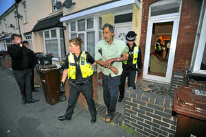 Arif is led away police