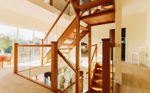 The 'impressive' staircase that winds through two floors. Picture: Purplebricks