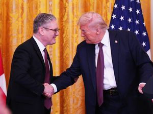 Prime Minister Sir Keir Starmer and US President Donald Trump shake hands in the East Room at the White House in Washington DC