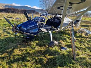 The pilot was airlifted to hospital after crash-landing in a field.