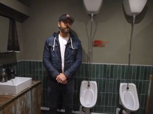 Supporting image for story: Ryan Reynolds unveils commemorative urinal for Rob McElhenney at Wrexham ground
