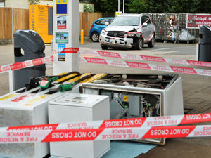 Supporting image for story: Paramedics, police and firefighters called as car hits petrol pump at garage