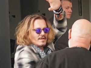 Supporting image for story: Johnny Depp cuddles orphaned badgers as he continues UK tour with Jeff Beck