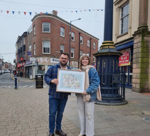 Cllr Andrew Tromans and Stourbridge-based artist Stacy Hammond holding the sought-after larger prints of the music map. 