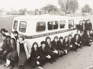Staff and pupils at Pendeford High School, raised money for a new mini bus through sponsored events. The photograph shows Tom Stroud with the minibus and some of the pupils.